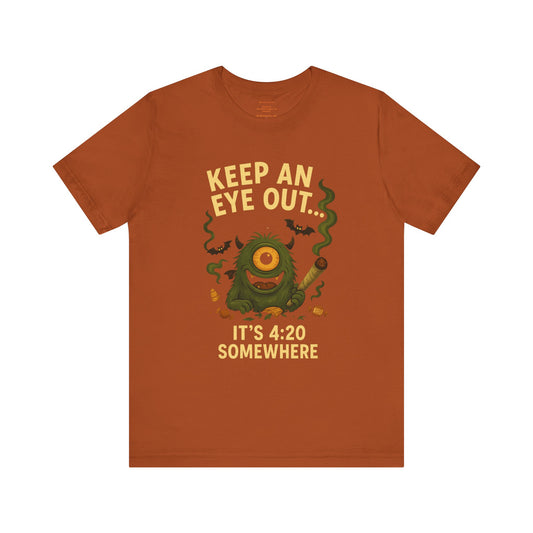 🕯️Keep an Eye Out — It’s 4:20 Somewhere (Ember Bud | Holidazed) Unisex Jersey Short Sleeve Tee